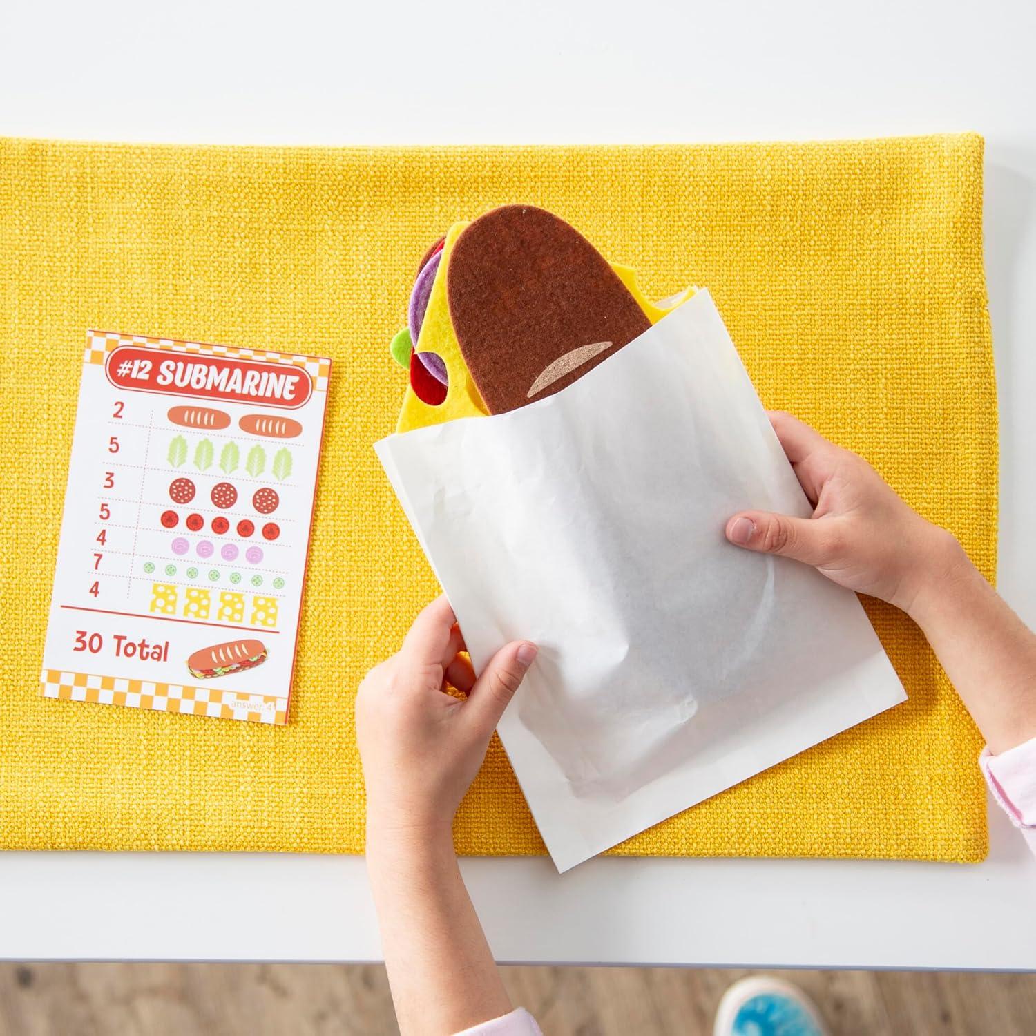 imagePeaceable Kingdom Math Sandwich Game Preschool Math Games for Kids Ages 3 and Up Includes 100 Felt Food Pieces 10 Menu Cards Dry Erase Marker ampamp Guest Check Tablet for Pretend Restaurant Play
